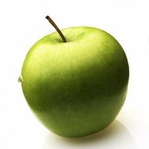 A green apple sitting on top of a table.