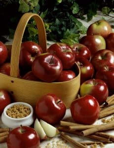 A basket of apples and nuts on the table