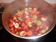 A steaming pot of chopped vegetables